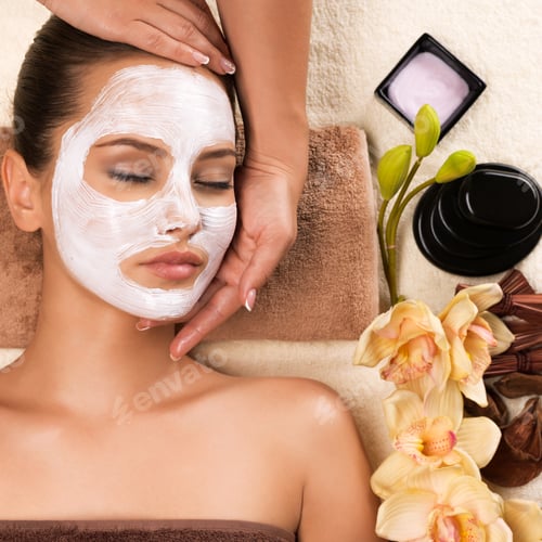 Preview: Woman with mask on her face having head massage.