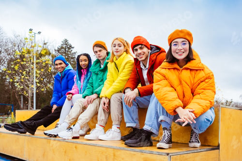 Preview: Multiracial group of young friends meeting outdoors in winter