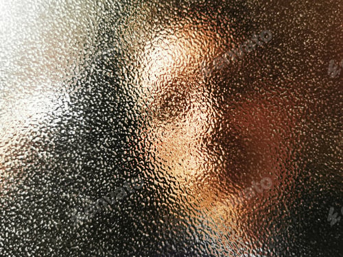 Preview: Person's face seen behind the glass texture with blurred effect