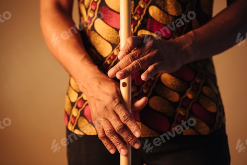 Preview: Detail of hands of African American man musician playing the flute with copy space. Online music