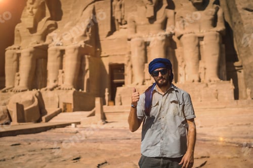 Preview: A young tourist with a blue turban visiting the Abu Simbel Temple in southern Egypt