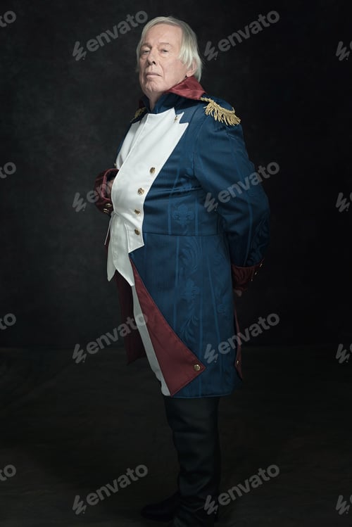 Preview: Official Portrait Of Senior Man Dressed In Historical Emperor Costume. Studio Shot Against Dark