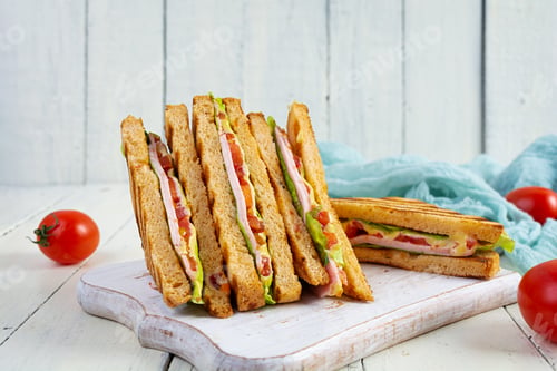 Preview: Club sandwich with ham, tomato, green and cheese. Grilled panini