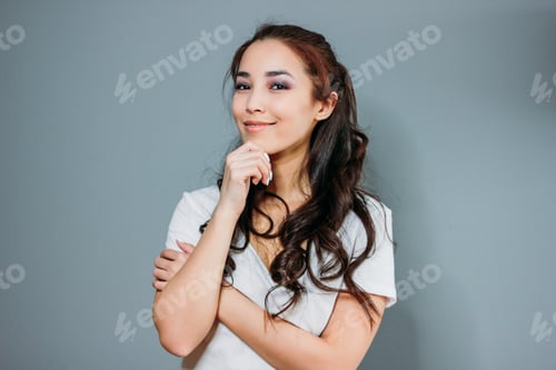 Preview: Beauty fashion portrait of smiling sensual asian young woman with dark long hair in white t-shirt on