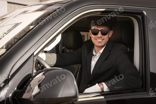 Preview: Professional driver in luxury car. Chauffeur service