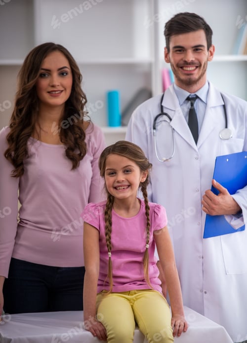 Preview: Happy child with mother and doctor in clinic.