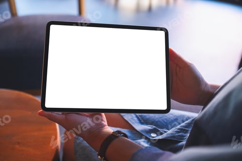 Preview: Mockup image of a woman holding and showing digital tablet with blank white desktop screen in cafe