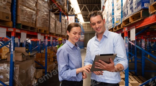Preview: Warehouse manager talking and checking product in warehouse.