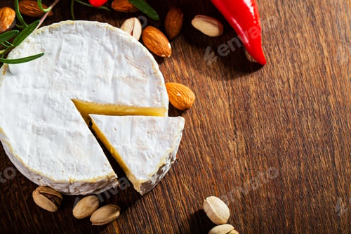 Preview: Camembert cheese or brie on wood background