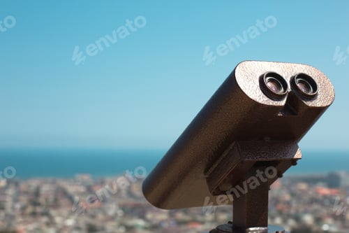 Preview: Binoculars from a height on the observation deck view of the panorama of the city and the sea