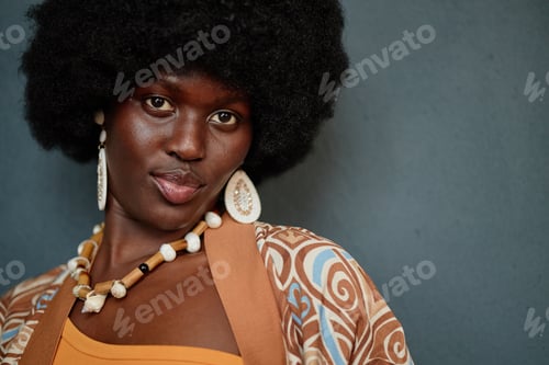 Preview: Portrait of Young Adult Black Woman Wearing Beaded Earrings Celebrating Kwanzaa