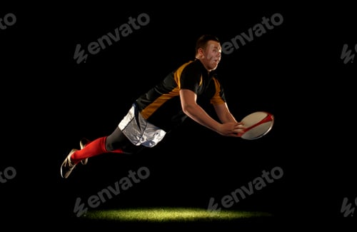 Preview: Rugby player diving an throwing ball
