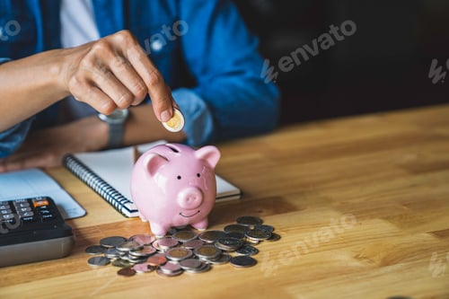 Preview: woman holds a coin in a pig-shaped piggy bank to save money for the future. after retirement and rec