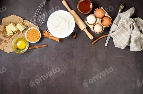 Preview: Ingredients for making dough dishes: cakes, cookies, muffins, pies on a dark background.