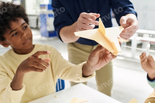 Preview: Schoolboy Playing with Plane He Made