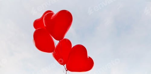 Preview: Red heart balloons on a background of sky.