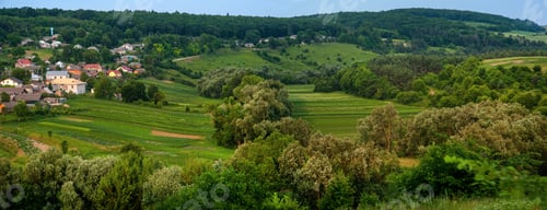 Preview: The landscape of the edge of the village, on the background of agricultural land, fields, trees