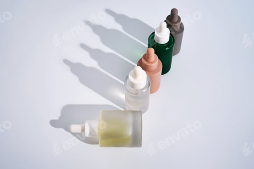 Preview: Skincare cosmetic serum bottles on white background