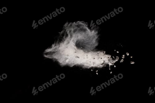 Preview: Split debris of stone exploding with white dust against black background.