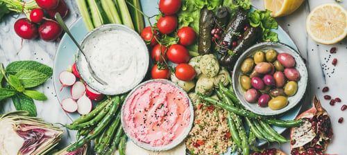 Preview: Healthy vegan snack and dip set over marble background, flat-lay
