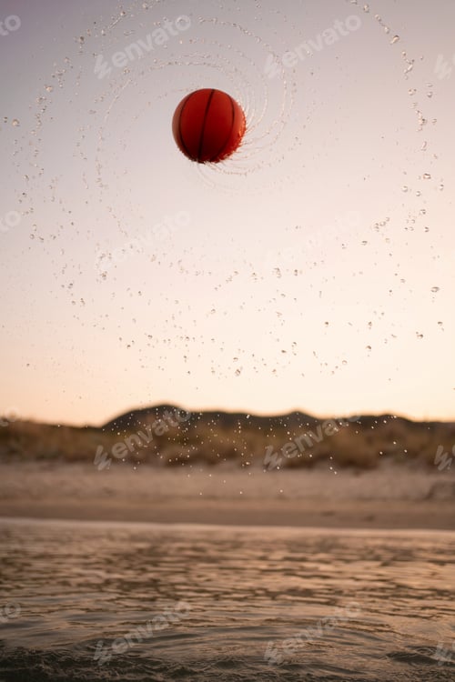 Preview: Family enjoys a vibrant sunset at the beach with a playful game