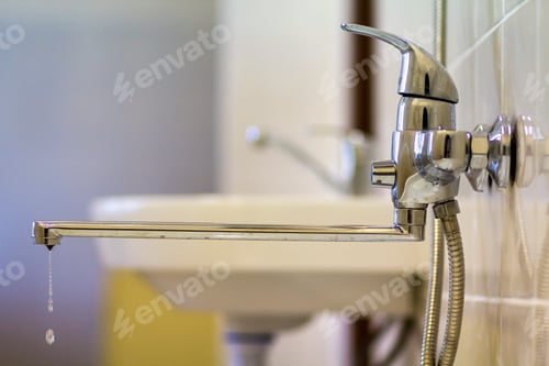 Preview: Water tap, chrome stainless metal faucet with running water stream connected to shower
