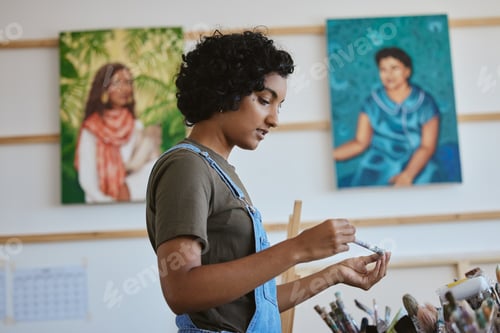 Preview: Creative, art and woman thinking in studio with choice of brush for next painting, artwork or desig