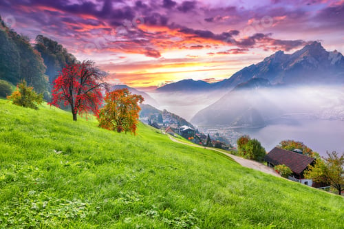 Preview: Gorgeous autumn view on suburb of Stansstad city and Lucerne lake with mountaines and fog