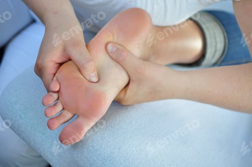 Preview: Relaxing Foot Massage on Blue Upholstered Surface