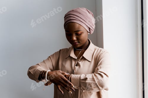 Preview: Muslim girl on white background, African business woman posing in studio ad