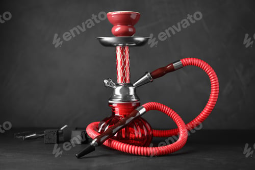 Red Hookah with Coal against Dark Background