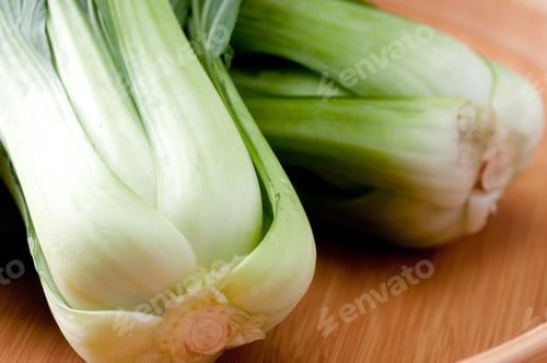 Preview: Closeup shot of bok choy cabbage in a wooden plate
