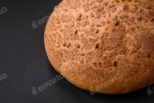 Preview: Fresh crispy brown bread with sesame seeds and spices