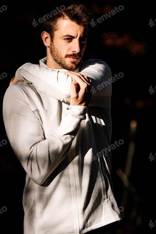 Preview: Young man running at park during autumn morning