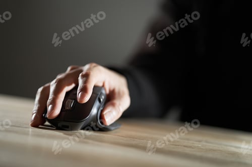 Preview: Hands of an Asian man operating a mouse