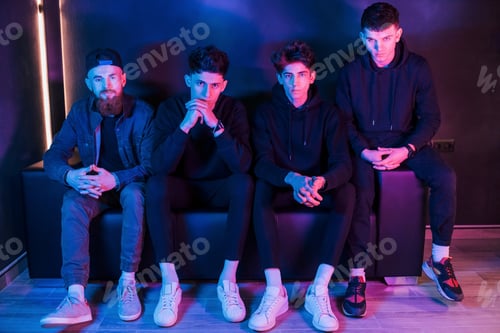 Preview: Group of people is together in the studio with futuristic neon lighting