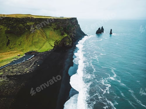 Preview: Reynisdrangar rocks on coastline of Reynisfjara black beach, Iceland