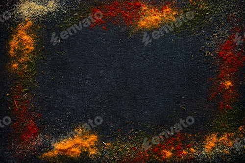 Preview: Spices powder on black slate background top view.