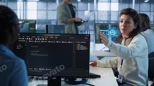 Preview: Angry woman getting computer crash while trying to fix error in data center