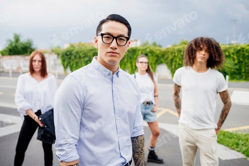 Preview: Confident young adults posing in a street style fashion