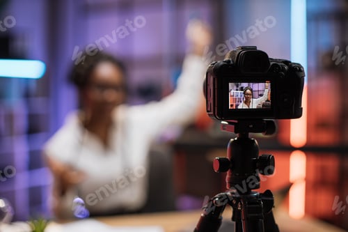 Preview: View of video camera screen with attractive confident african american skilled business woman