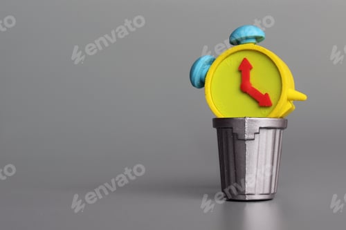 Preview: Alarm clock inside garbage can