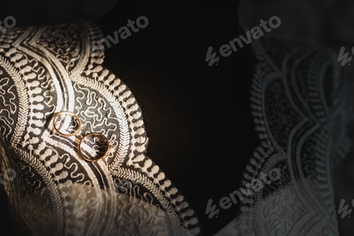 Preview: Beautiful wedding gold rings on dark background