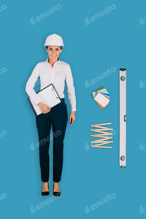 Preview: top view of female builder with clipboard, collapsible meter and building level isolated on blue