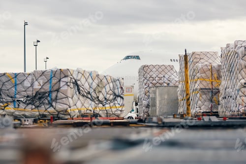 Preview: Loading of cargo containers to plane at airport