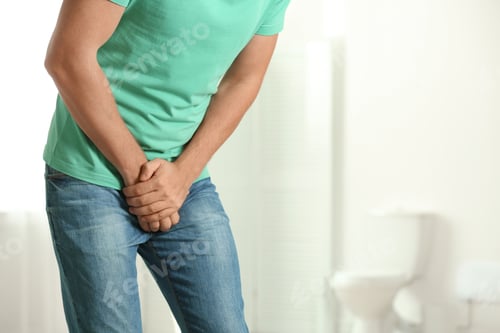 Preview: Man suffering from pain indoors, space for text. Urology problems