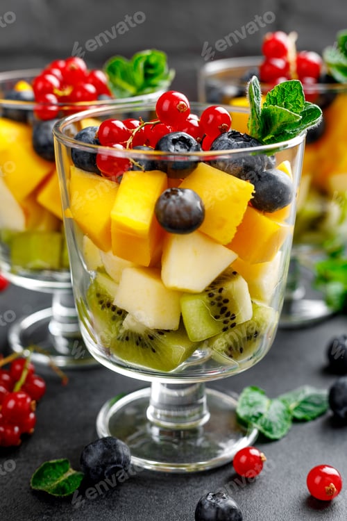 Preview: Fresh salad with fruits and berries in glass