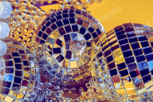 Preview: disco ball concept. Isolated on yellow background