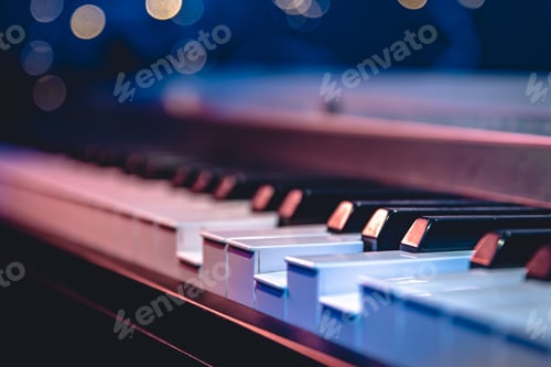 Preview: Piano keys close-up on a blurred background with bokeh.