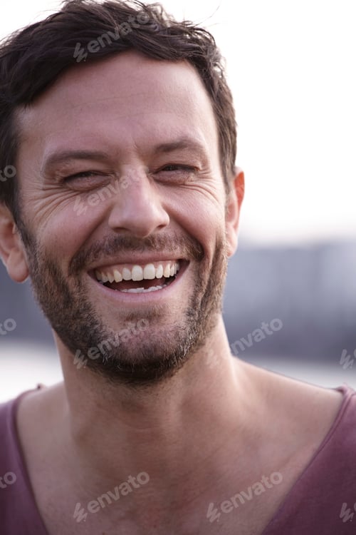 Preview: Portrait of laughing man outdoors